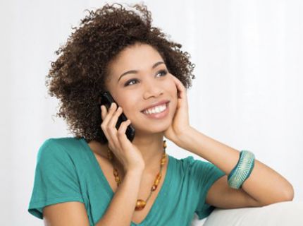 woman smiling on the phone