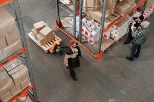 image of a warehouse trolley moving packages for the blog How Can Integrating 3PL Solutions Elevate Your Business's Logistics Operations